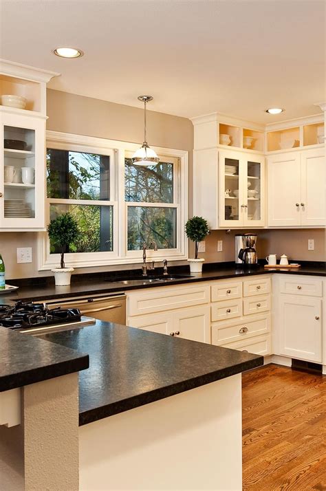 white cabinets with dark countertops